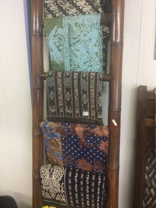 Batik textiles, bamboo ladder, carved lattice work 19th century screen.