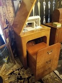 sewing machine with drawer style pull out seat, very cute!