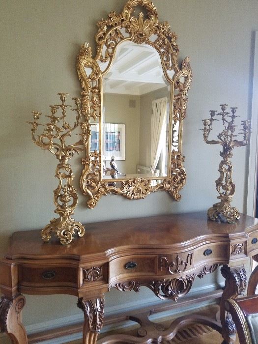 Oversized custom mirror and large candelabras with wood carved buffet