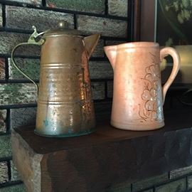 Vintage brass and clay pitchers