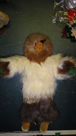 Wood Carved face Inuit in fur outfit.