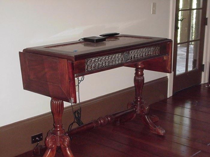 Drop leaf sofa table with grill front and turned legs and stretcher