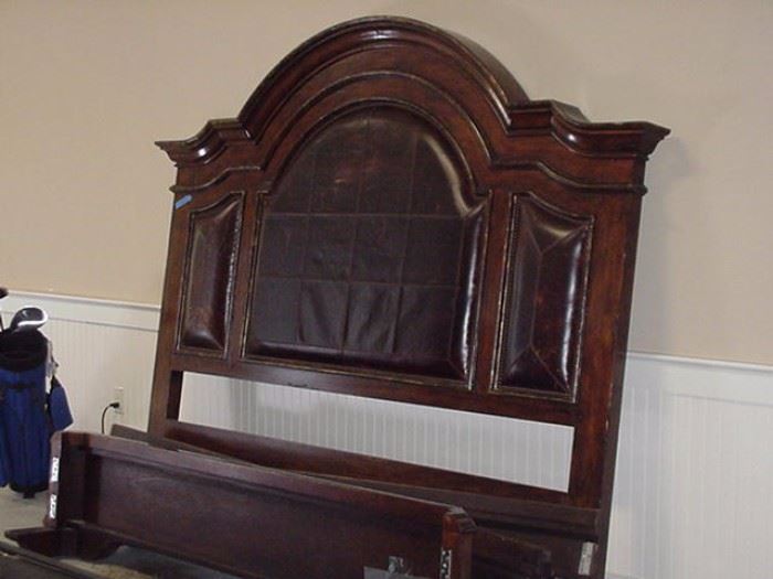 Marge Carson king-size bed with leather inserts and wood frame.  