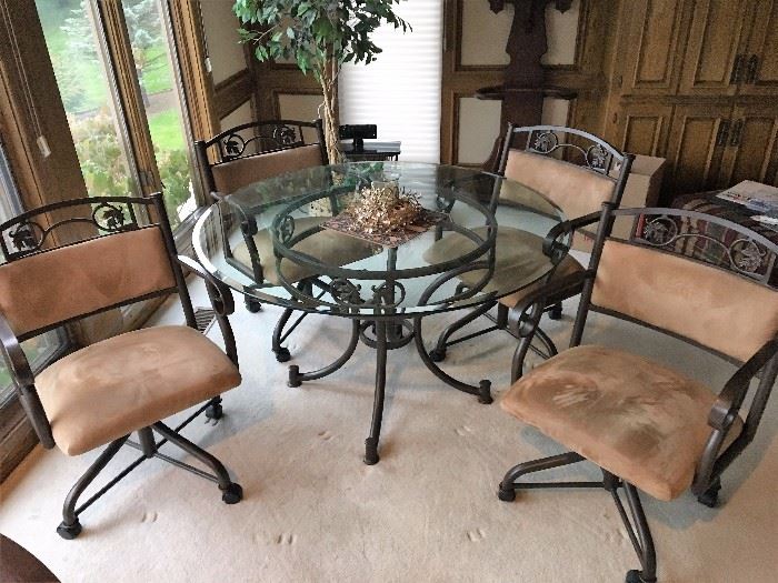 Glass top dining table and 4 swivel chairs