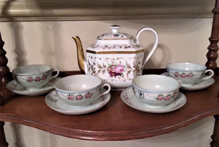 China tea cups and saucers.  Tea pot.