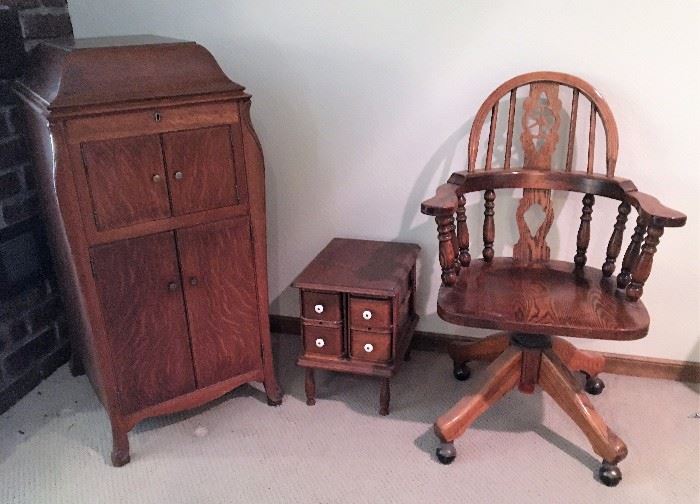 Wooden roller desk chair, Victrola, sewing box.