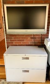 Low two drawer file and television