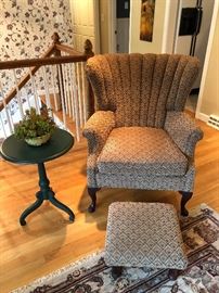 Scallop backed upholstered arm chair with ottoman