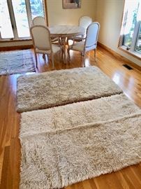 Flokati rug -- handmade shag wool rug. Making flokatis is a long-time tradition of the Vlachs in the Pindus mountains. The entire rug is wool, including the backing from which the tapered shag emerges.