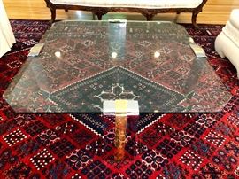 Glass and chrome modern table atop Persian Rug in Blue, Red and White