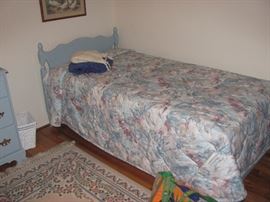 One of 2 matching twin beds
