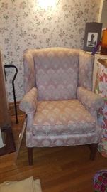 One of a pair of winged back chairs