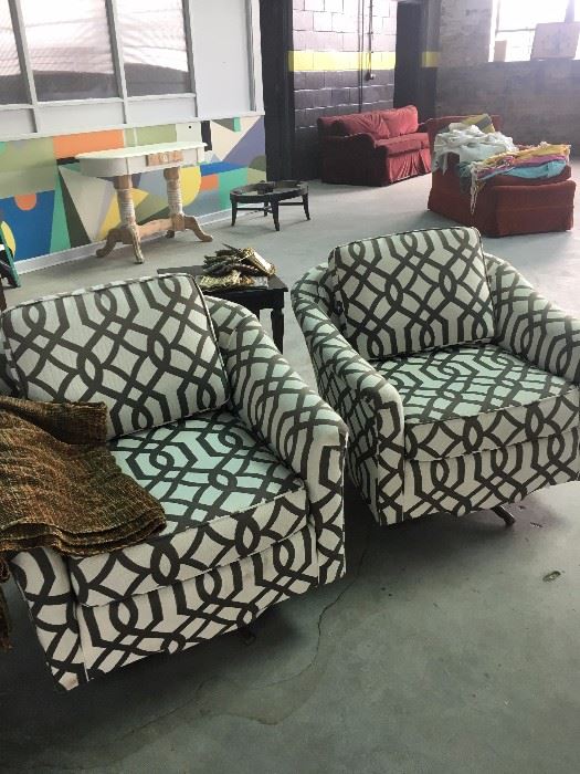 Two mid-century modern swivel chairs, newly upholstered. 