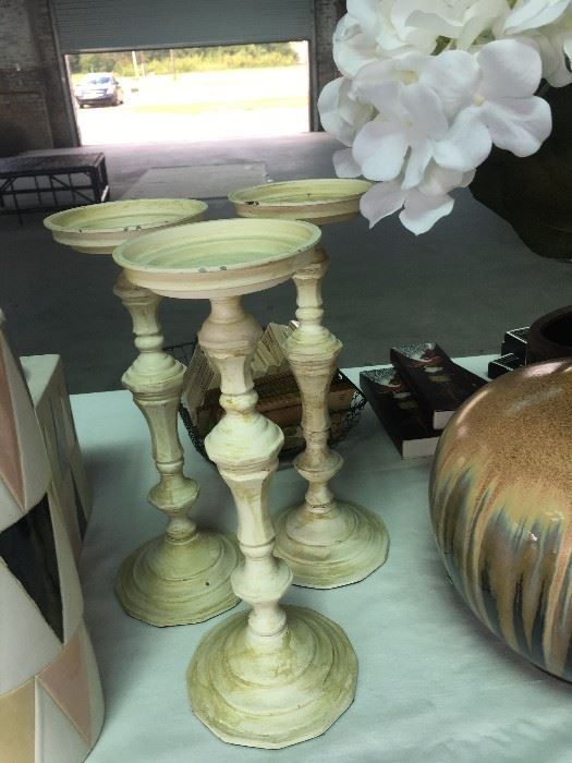 Candle sticks in distressed ivory. 
