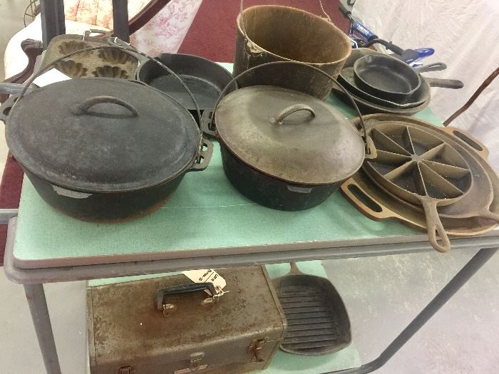 Cast iron galore: Various size Skillets , Dutch ovens , kettle, corn bread and muffin pan 