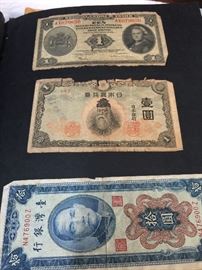 Antique Foreign Money in a military collection scrap book 