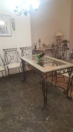 Wrought Iron Table & 6 Chairs.  Some Chairs need reupholstered (We have some nice fabric for the job!)