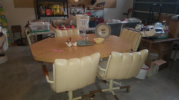 Table & 4 Rolling Chairs.  Chairs need recovered or repaired. Priced to sell quickly