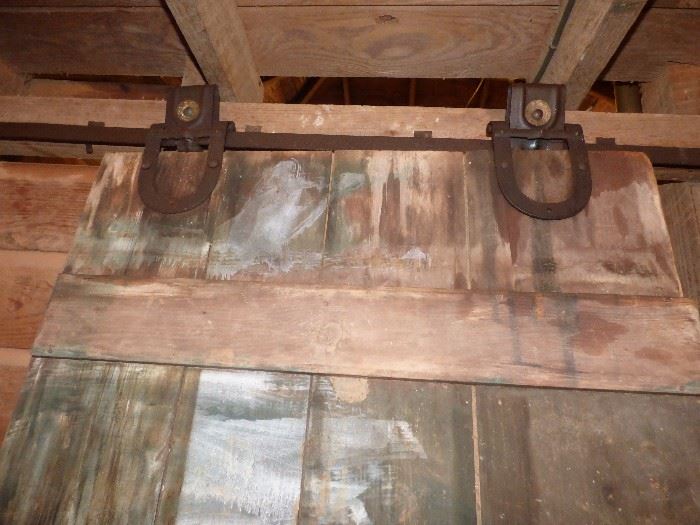 This is a REAL sliding barn door with original hardware !