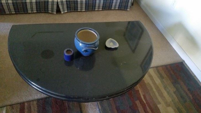 COFFEE TABLE HALF MOON SHAPED AND OPENS TO FULL MOON.