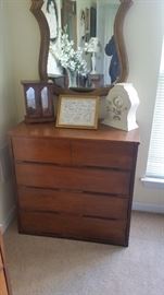 MID CENTURY CHEST OF DRAWERS PLUS ANTIQUE MIRROR HANGING ON WALL
