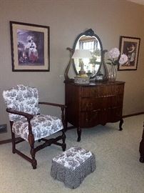 Mahogany dresser  -  Antique chair and ottoman in toile fabric  -  Framed prints