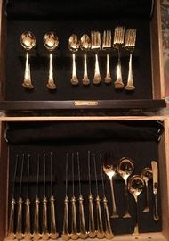 Oneida stainless, gold plated. 12 forks, salad forks, spoons, soup spoons, and knives. 1 butter, sugar, slotted spoon, salad fork and spoon. 