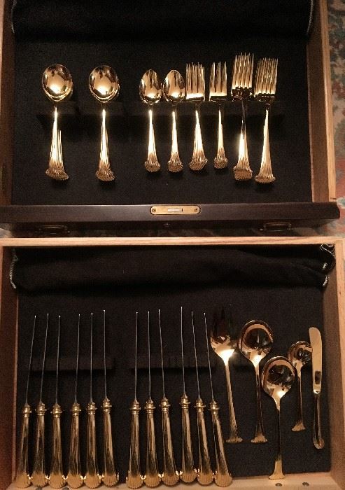 Oneida stainless, gold plated. 12 forks, salad forks, spoons, soup spoons, and knives. 1 butter, sugar, slotted spoon, salad fork and spoon. 