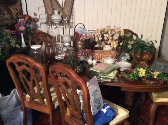 Six seat dining room set.   Lots of floral arrangements
