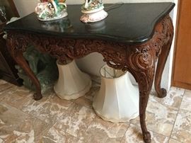 Lovely carved Library Size Table with black marble top with curved edges