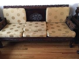 Exquisite carving on three back sections, arms, side sections. Sofa, side chairs, ottomans coffee table and side tables all available