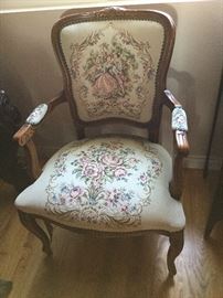 Victorian style arm chair with couple frolicking on the back panel