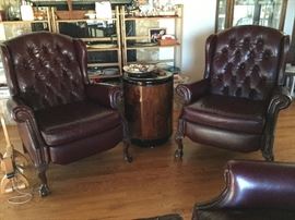 Pair of leather recliner chairs with round side table