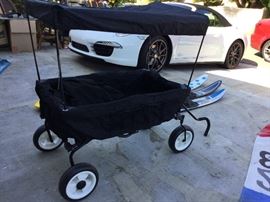 Great cart with sun shade top folds up completely and easily into a case for travel