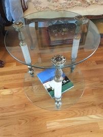 Very fancy glass legs on this metal and glass end table