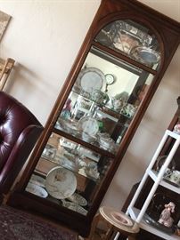 Five high display cabinet, well lighted, arch top glass on door, has lock but do not need to use for opening, closing