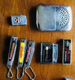 Collection of vintage lighters and clippers. Harley Davidson, Hershey’s, and more!