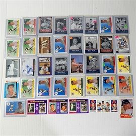 Mickey Mantle Card Lot: A collection of Mickey Mantle cards. The lot consists of thirty eight cards, with archives from the 1990’s and 2000’s. A notable group of three 1975 Mickey Mantle cards are included.