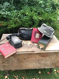 Old Telephone , Farmhouse Table, Lock Box with key, Satchel possibly Medical Bag, Books Famous Men of the Revolution and William McKinley  