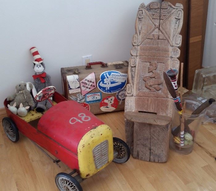 Vintage pedal car, old suitcase with travel stickers, 2 piece carved African chair, 