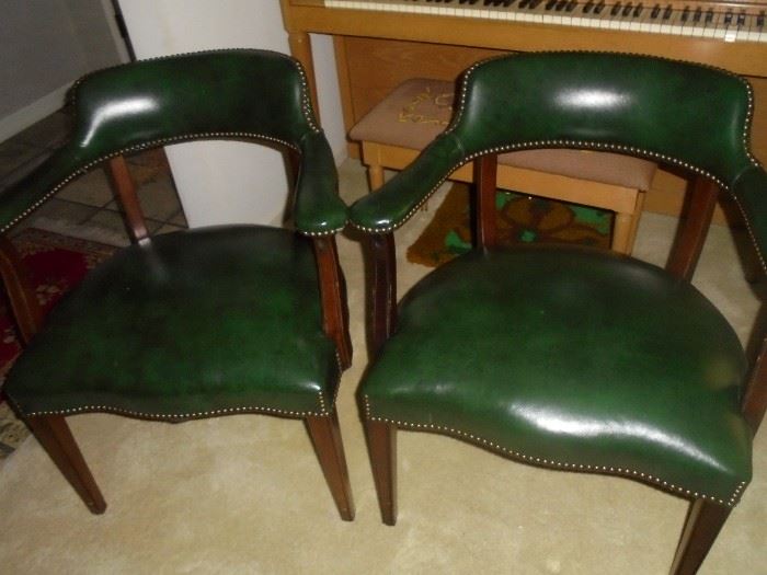 2 green leather office chairs