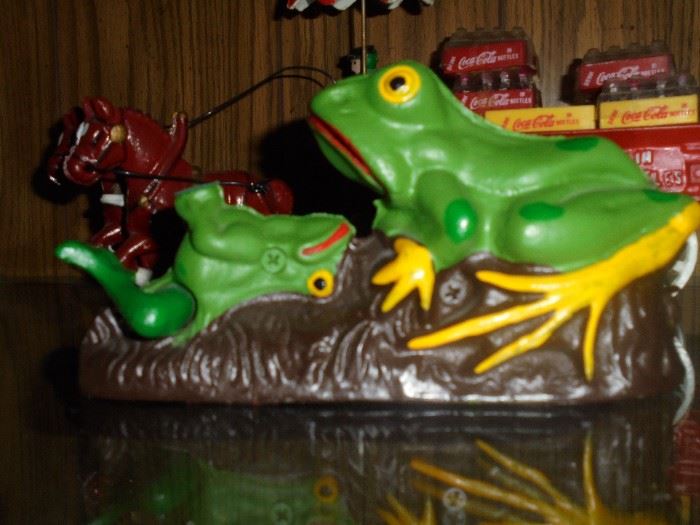 cast iron bank frog tossing coin in to mouth