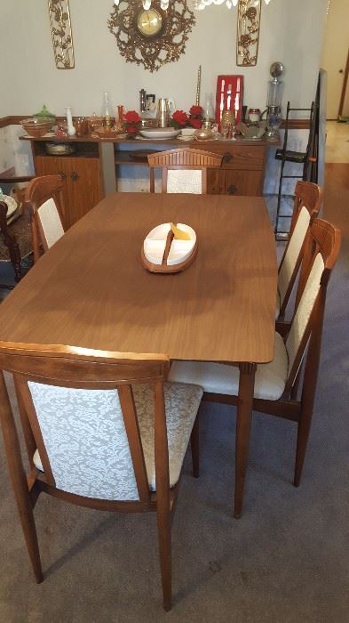 Dining table with 6 chrs.  - one leaf is in table here