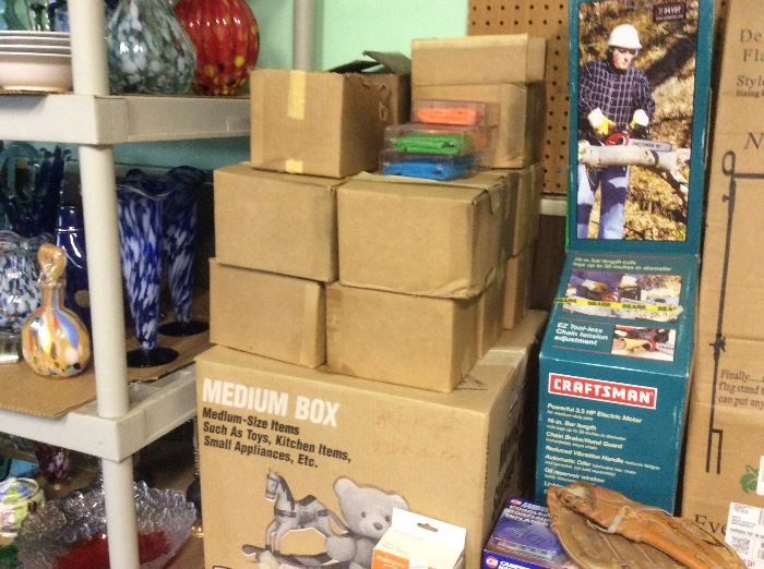 Boxes and boxes of insect repellent and a small new Craftsman chain saw
