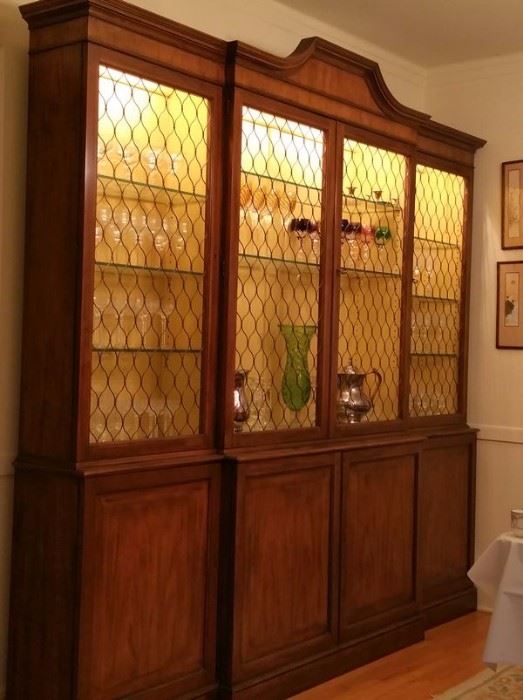 Spectacular Baker 8' bookcase/china cabinet with metal screening (no glass front). 