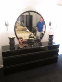 Black enameled dresser, mirror with matching towers and headboard made in Italy.