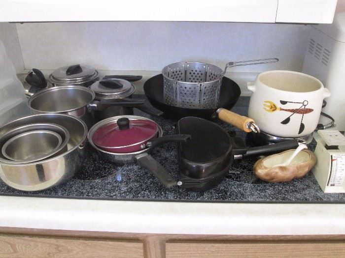 Pots and pans, mixing bowls and a Retro West Bend crockery pot on a hot tray