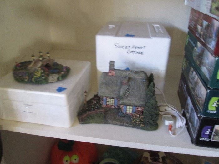 Thomas Kinkade Christmas village display items with boxes