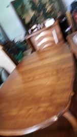 Ethan allen table and chairs. Also a china cabinet.