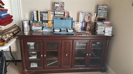 media console, electronics, dvds, vhs tapes, cassette tapes and cd's